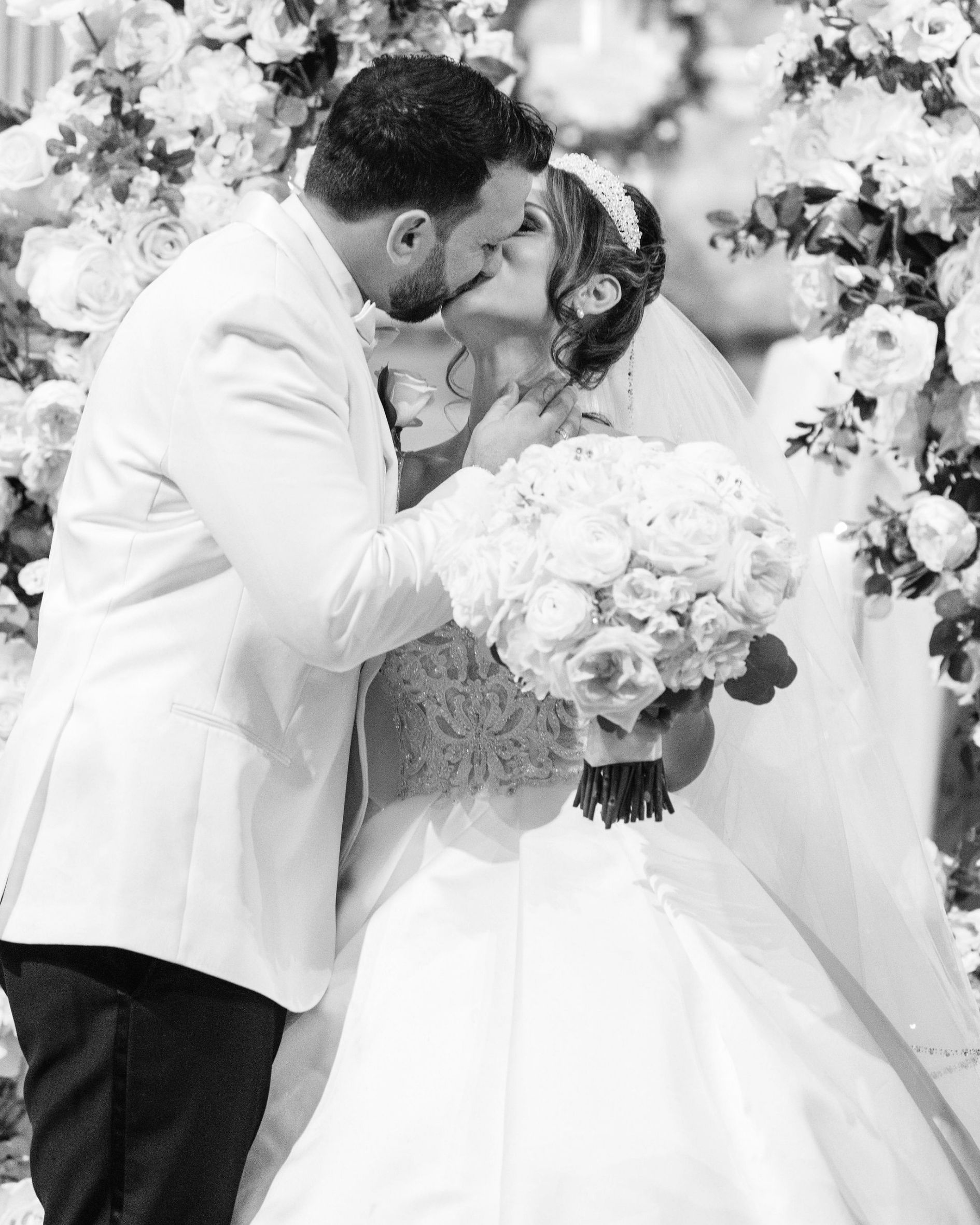 Greek Bride and Groom kiss at Assumption Greek Orthodox Church